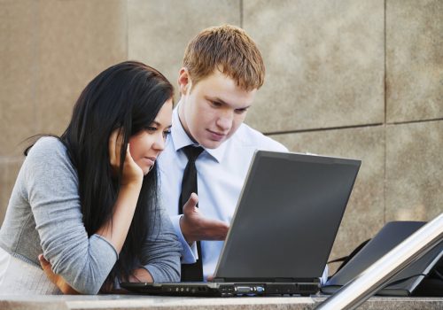 Young couple working on laptop